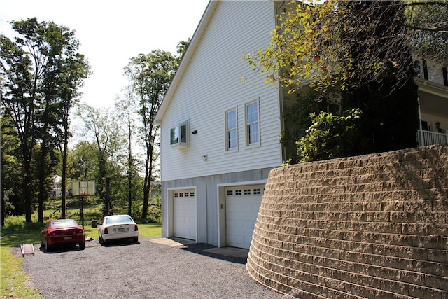 view of side of property featuring a garage