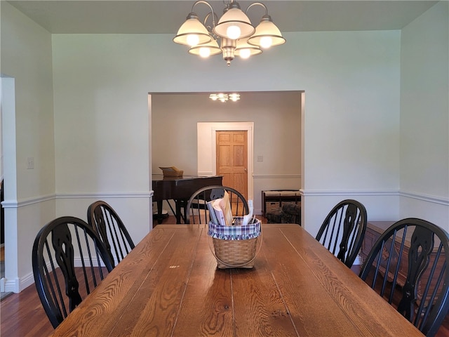 dining area featuring a chandelier and hardwood / wood-style flooring