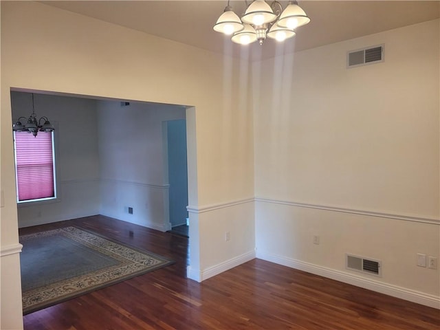 629 Euclid Ave, Grove City Boro, PA 16127 - unfurnished room with a chandelier, wood finished floors, and baseboards