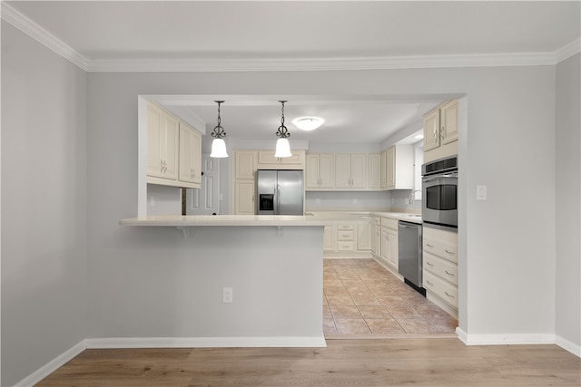 kitchen featuring cream cabinets, stainless steel appliances, ornamental molding, kitchen peninsula, and light wood-type flooring