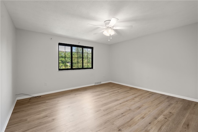 unfurnished room featuring ceiling fan and light hardwood / wood-style floors