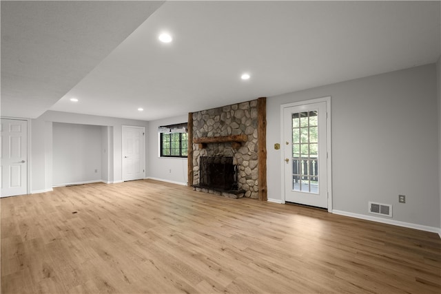 unfurnished living room with light hardwood / wood-style flooring and a fireplace