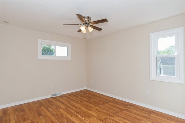 unfurnished room with wood-type flooring and ceiling fan