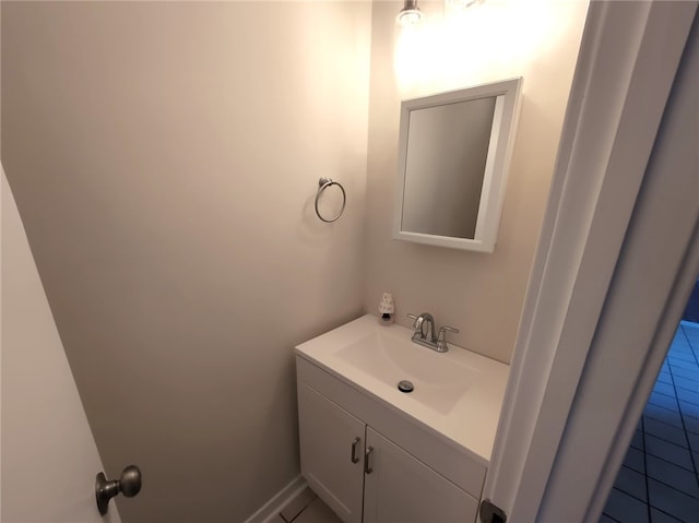 bathroom with tile patterned flooring and vanity