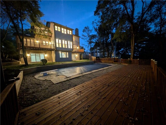 view of deck at twilight