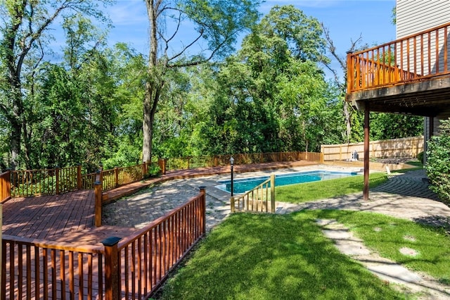 view of yard with a swimming pool side deck