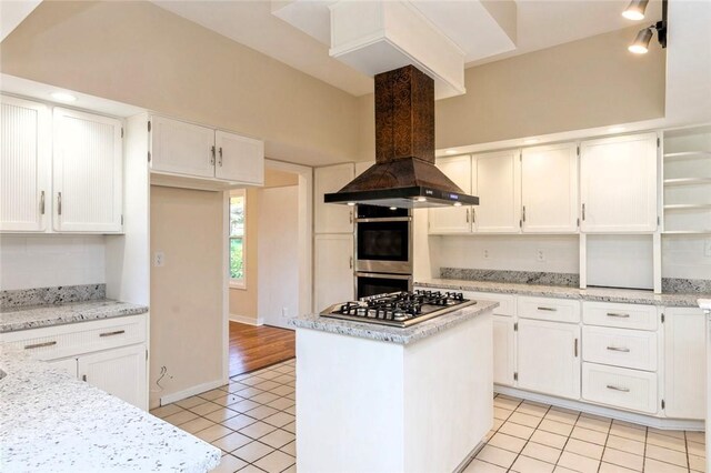 kitchen featuring a kitchen island, appliances with stainless steel finishes, white cabinets, and island exhaust hood