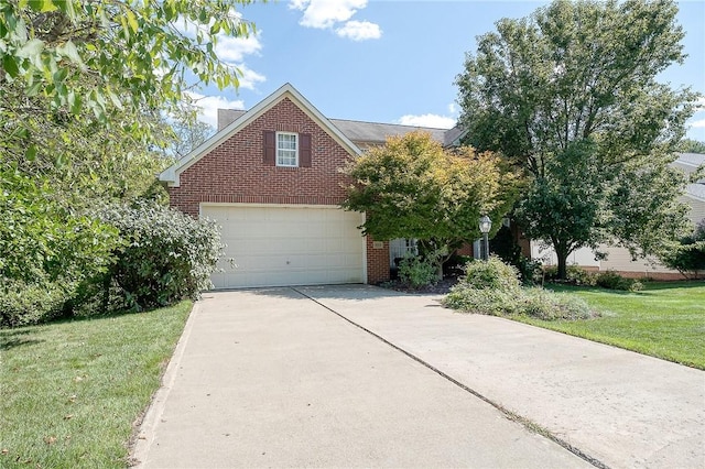 view of front facade with a garage and a front lawn