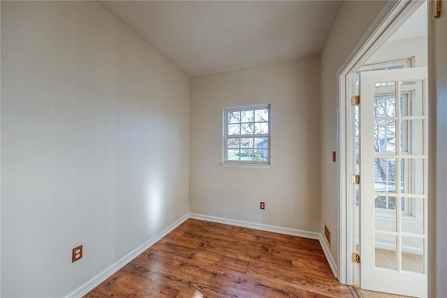 empty room with hardwood / wood-style flooring