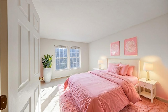 bedroom featuring light colored carpet