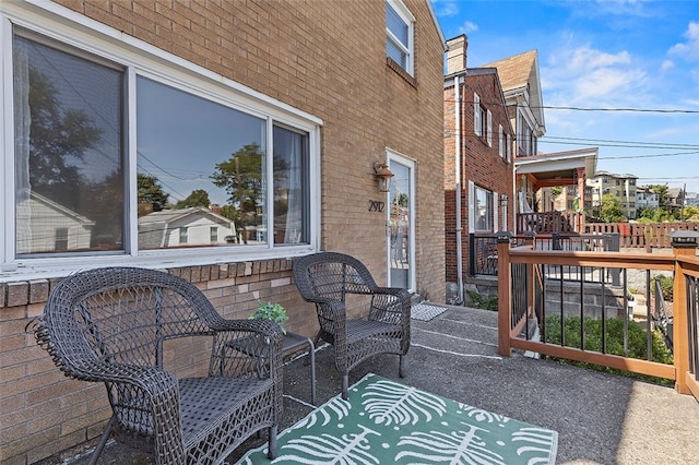 exterior space with a patio area and a deck