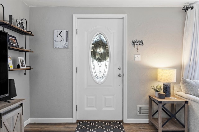 entrance foyer with dark hardwood / wood-style flooring