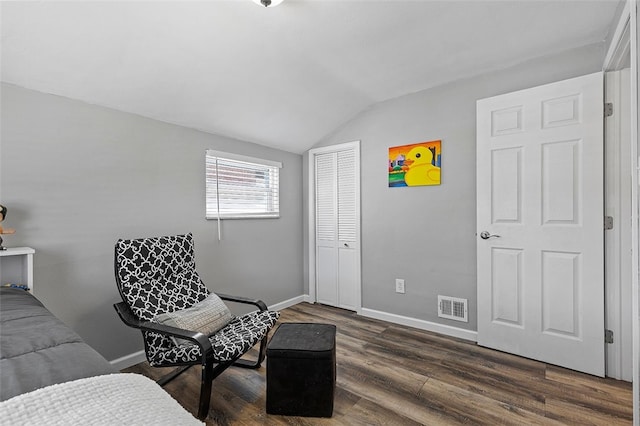 sitting room with lofted ceiling and dark hardwood / wood-style floors