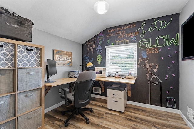 office space with hardwood / wood-style floors and vaulted ceiling