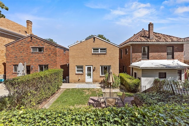 rear view of house featuring a patio area