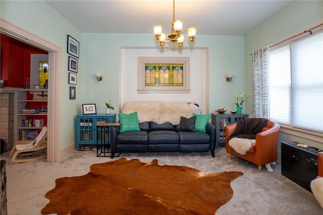 living room with a notable chandelier and carpet floors