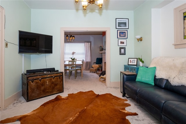 carpeted living room featuring an inviting chandelier