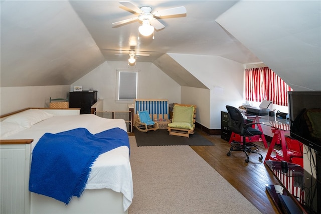 bedroom with dark hardwood / wood-style flooring, ceiling fan, and lofted ceiling