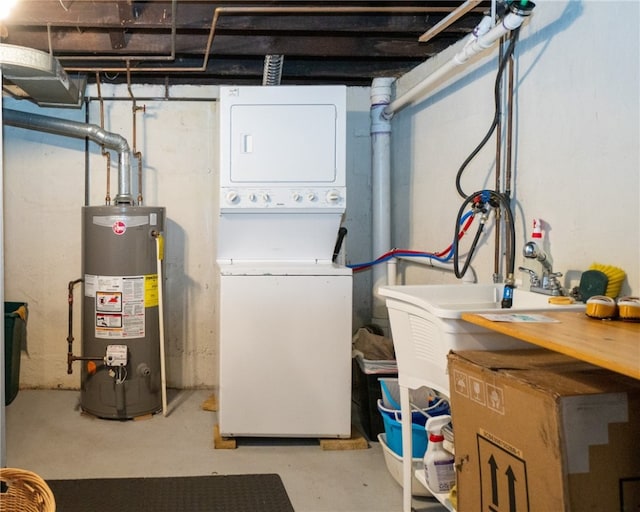 laundry area featuring stacked washing maching and dryer and water heater