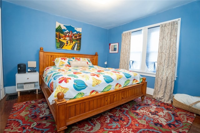 bedroom with wood-type flooring