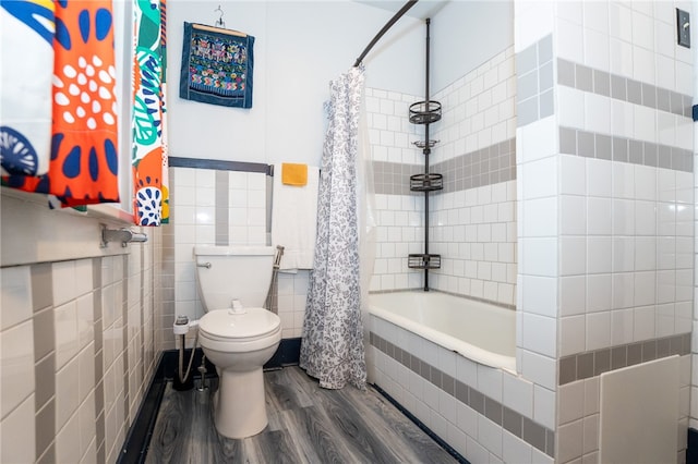 bathroom with tile walls, wood-type flooring, toilet, and shower / tub combo with curtain