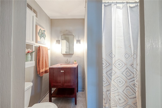 bathroom featuring tile patterned flooring, vanity, toilet, and a shower with shower curtain