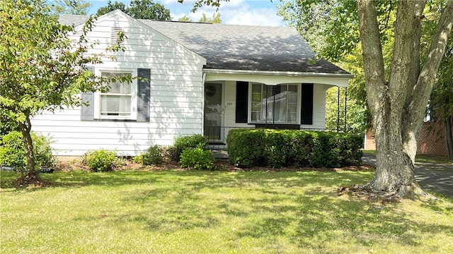 bungalow-style home featuring a front yard and a porch