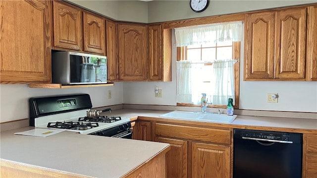 kitchen featuring black appliances and sink