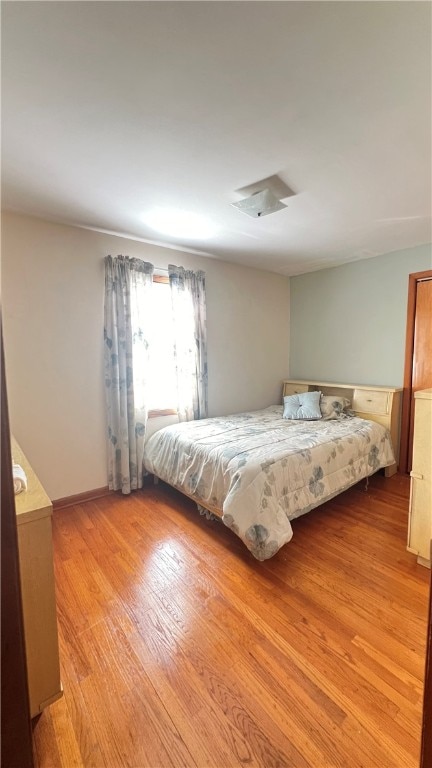 unfurnished bedroom with light wood-type flooring