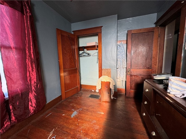 bathroom with vanity and hardwood / wood-style flooring