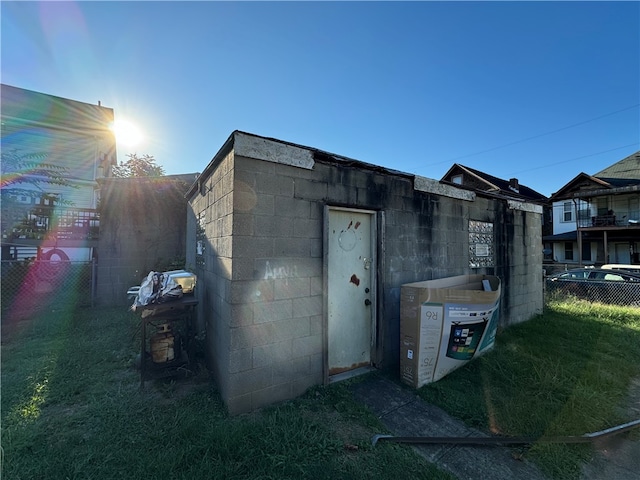 view of outbuilding featuring a yard