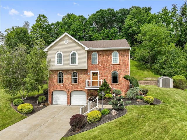 view of front facade featuring a storage shed, a front lawn, and a garage