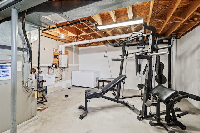 workout area featuring sink and concrete floors