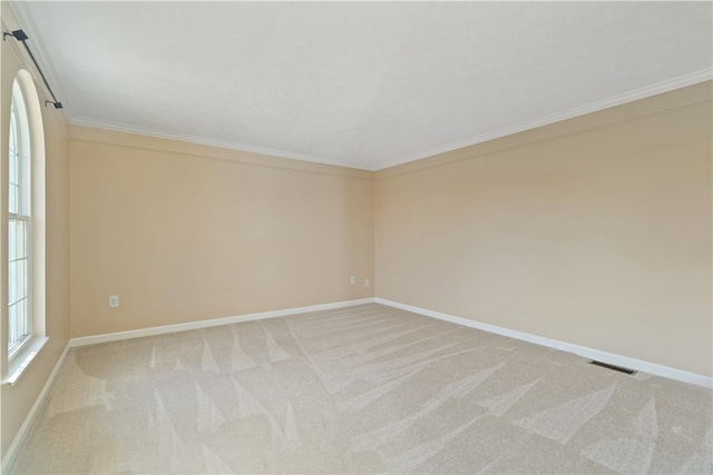 carpeted empty room with ornamental molding