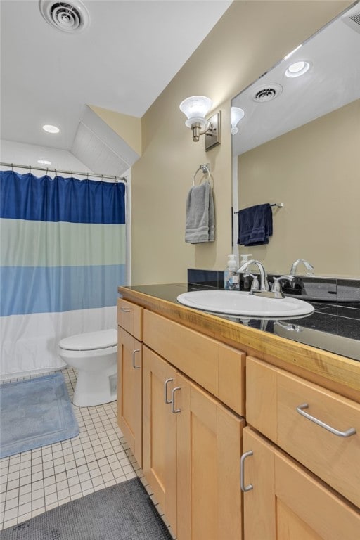 bathroom with vanity, toilet, a shower with shower curtain, and tile patterned flooring