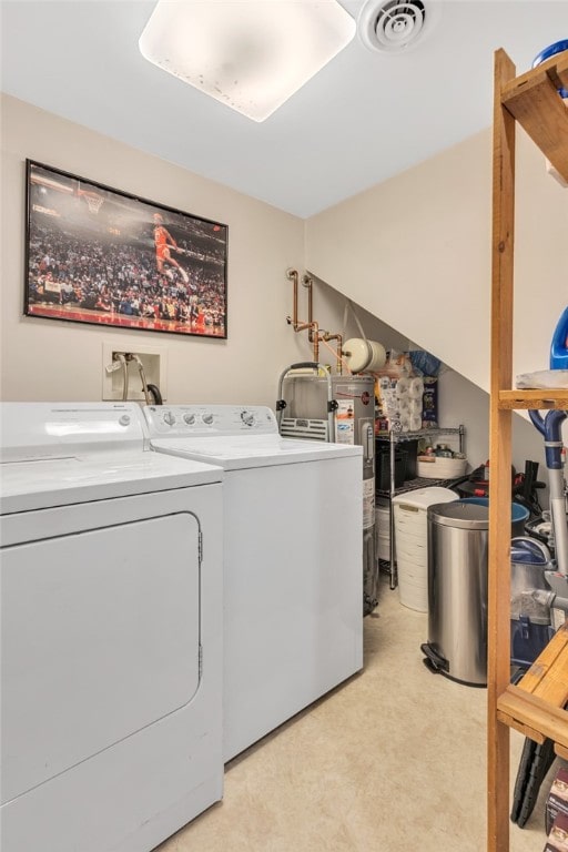 laundry room featuring separate washer and dryer, light carpet, and electric water heater