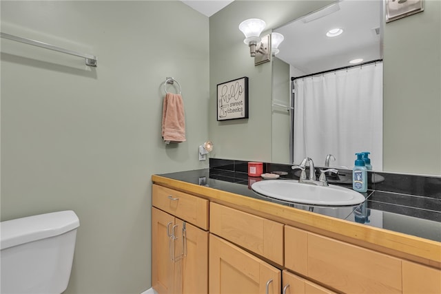 bathroom with vanity and toilet