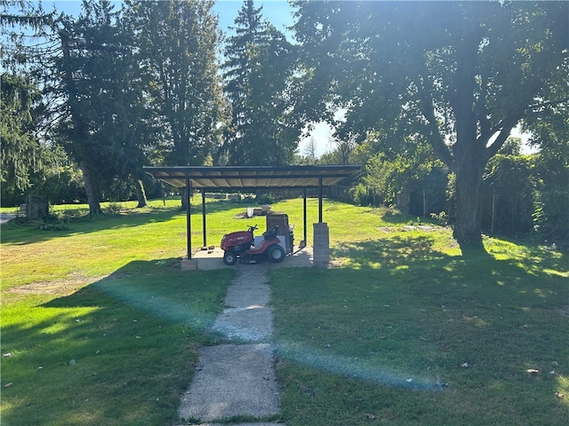 view of property's community with a lawn and a carport