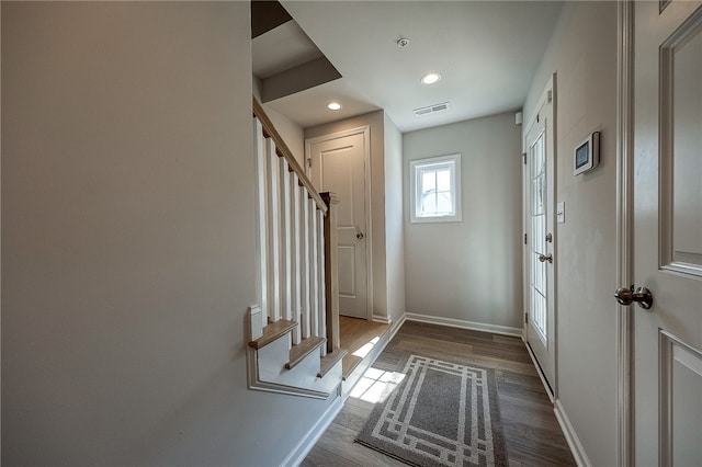 entryway with hardwood / wood-style floors