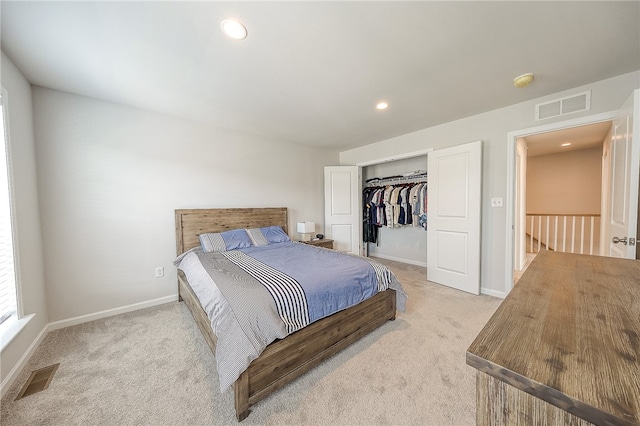 bedroom featuring carpet and a closet