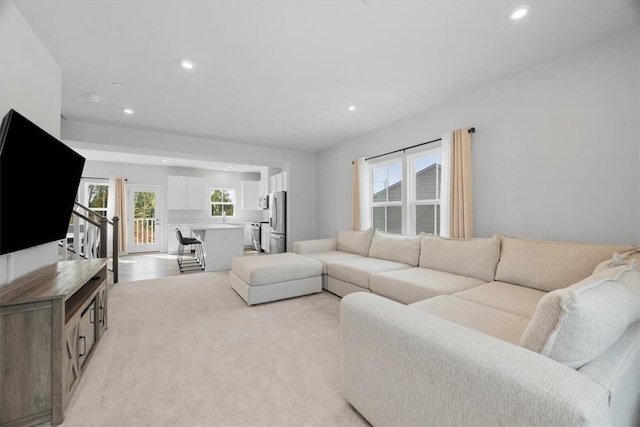 living room with light colored carpet