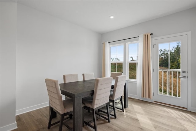 dining area with plenty of natural light and light hardwood / wood-style floors