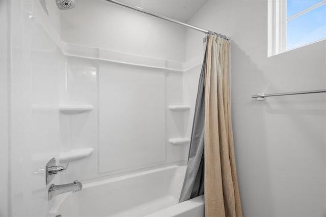 bathroom with shower / tub combo