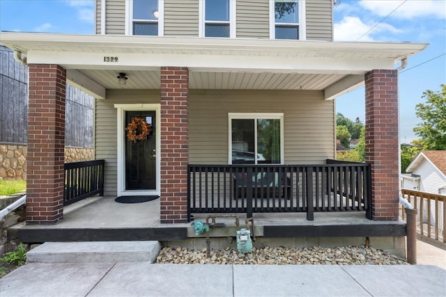 property entrance with covered porch