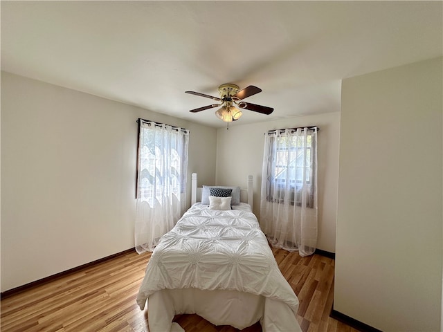 bedroom featuring ceiling fan and light hardwood / wood-style floors