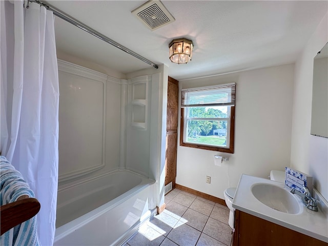 full bathroom featuring toilet, tile patterned flooring, vanity, a textured ceiling, and shower / tub combo