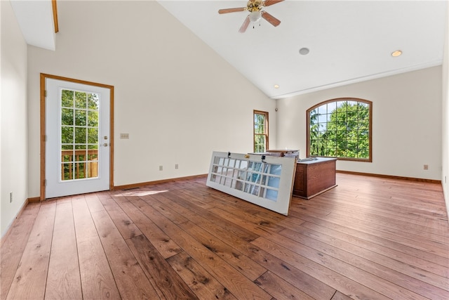 interior space featuring high vaulted ceiling, a healthy amount of sunlight, light hardwood / wood-style flooring, and ceiling fan