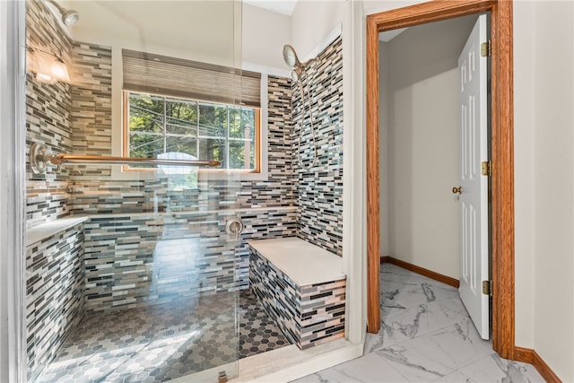 bathroom with tiled shower