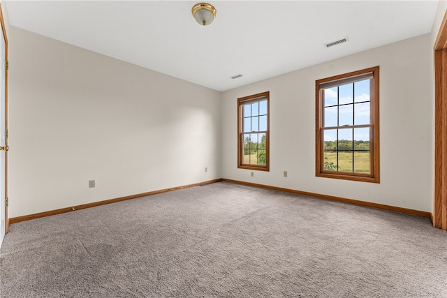 unfurnished room with carpet floors