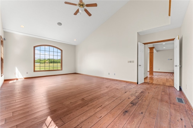 interior space featuring ceiling fan, high vaulted ceiling, and light hardwood / wood-style floors